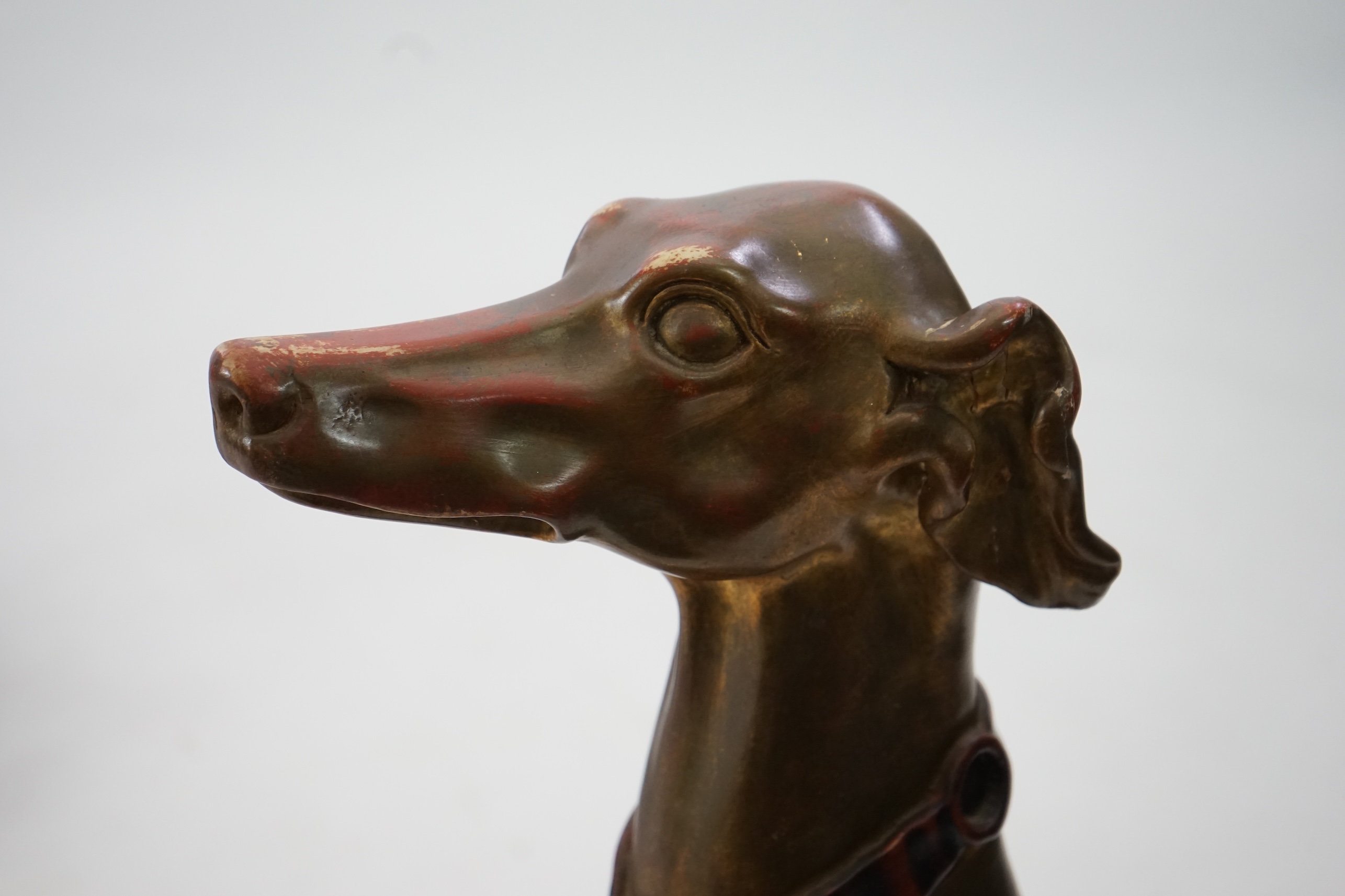 A 20th century Italian gilt and painted model of a seated Greyhound